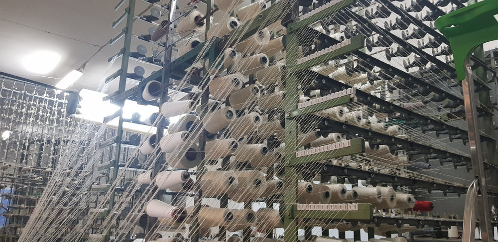 Spools of hemp yarn on a mill creel